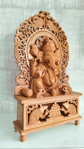 Grand Hand-Carved Wooden Ganesha Sculpture on Pedestal with Prabhavali and Mushaks